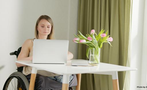 Woman with disability using her laptop 