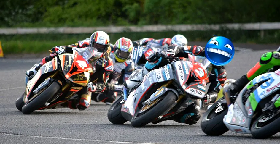 A pack of riders leaning into a tight corner during a track day.