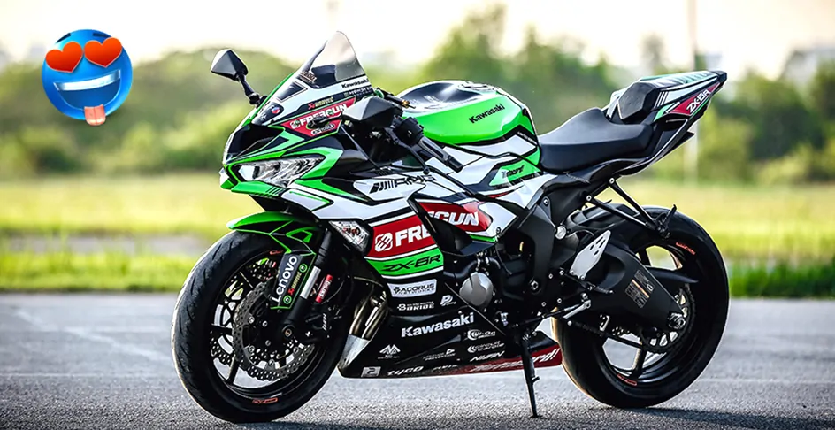 A Kawasaki ZX-6R superbike with full racing livery parked on a track.