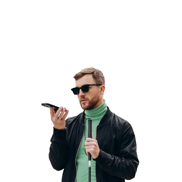 A blind man uses his smartphone on speakerphone while holding a white cane.