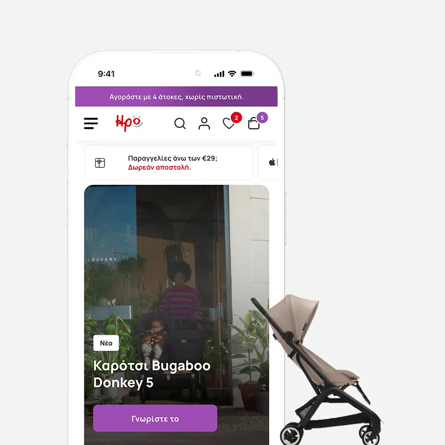 A close-up view of a mobile phone mockup displaying the irokids.gr homepage. The screen shows the top brand header, a notification bar for free shipping over twenty-nine euros, and a lifestyle video banner advertising the Bugaboo Donkey 5 stroller with a purple button. A physical beige stroller is layered dynamically behind the right side of the phone.