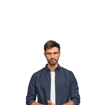 A man stands with hands clasped, looking directly at the camera.