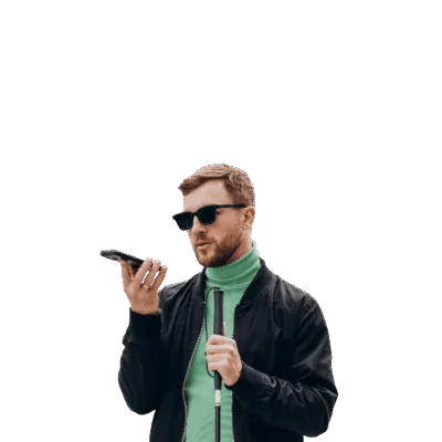 A blind man uses his smartphone on speakerphone while holding a white cane.