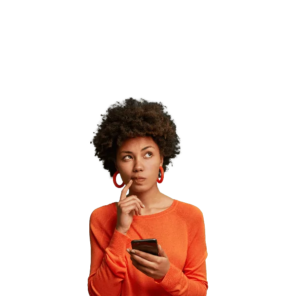 A woman holds a smartphone and looks upward thoughtfully.